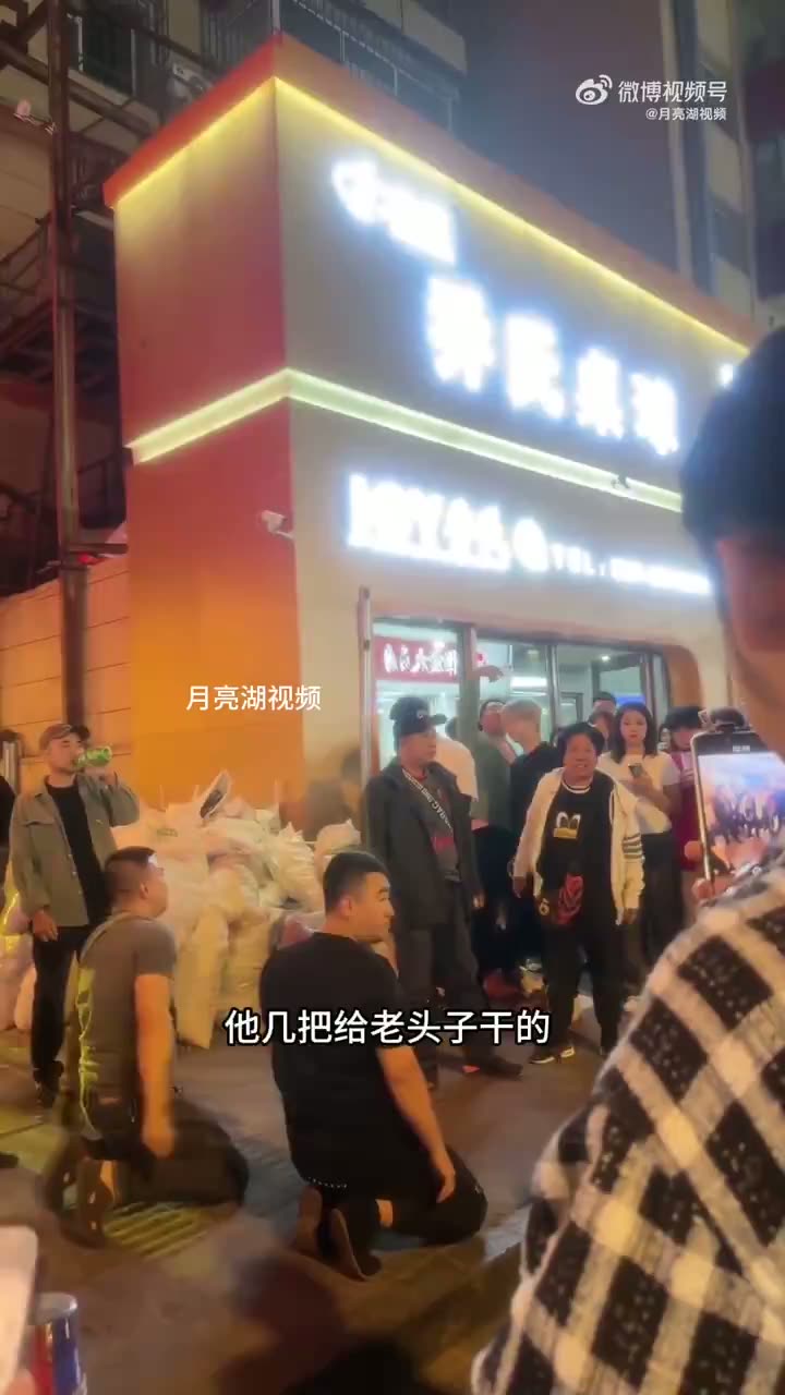 Two Men Kowtow and Crawl After Stall Is Removed