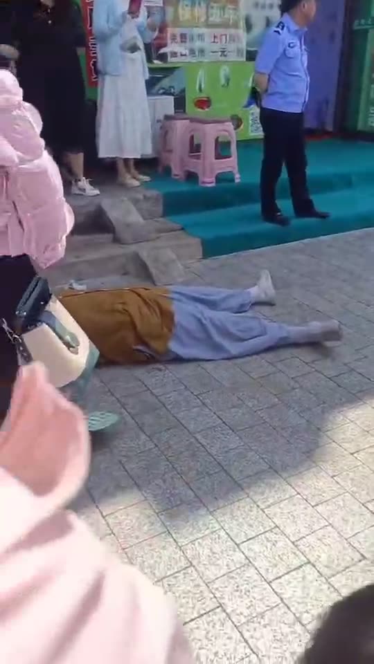 Person Lies Down Beside School Cordon in Jilin